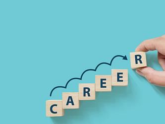 Building blocks spelling out the word, career, indicating progress at work